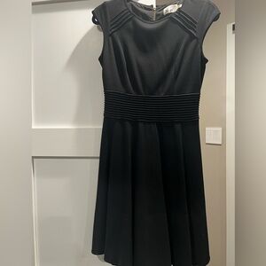 Black cap sleeve knee length dress